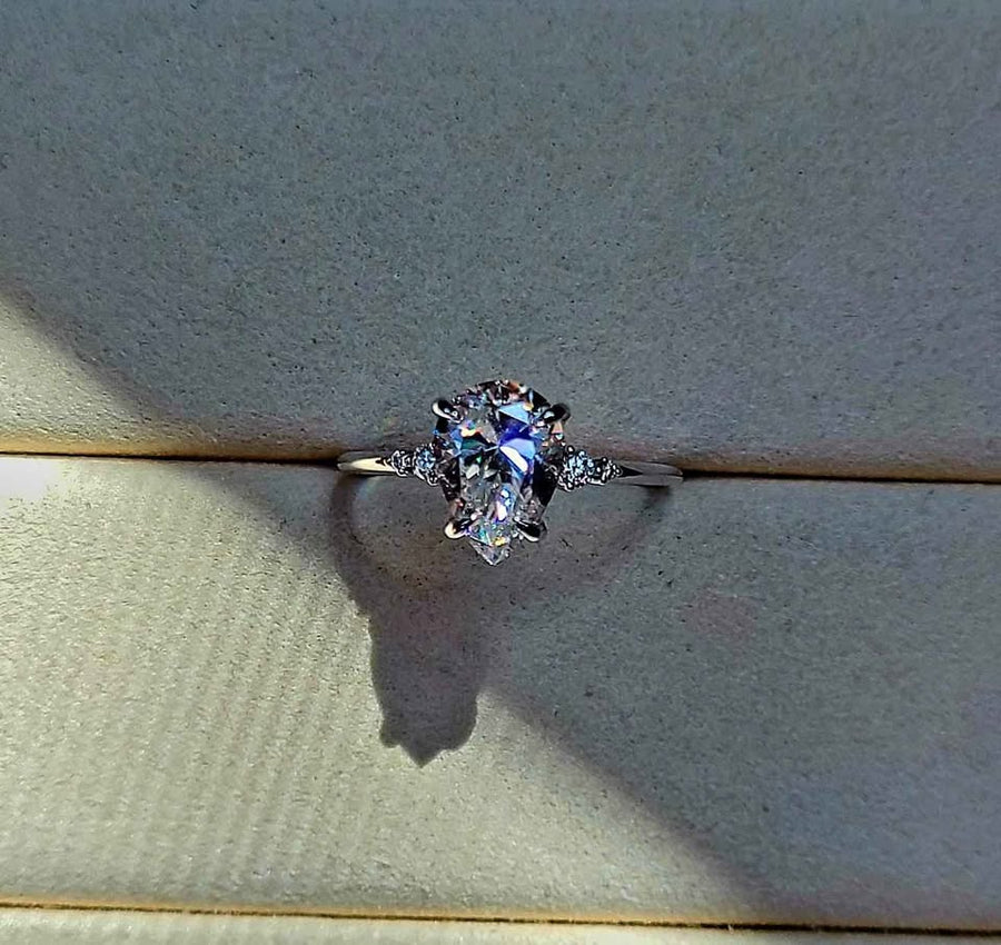 solid 14k gold 2ct 7x10mm pear moissanite ring with side moissanite