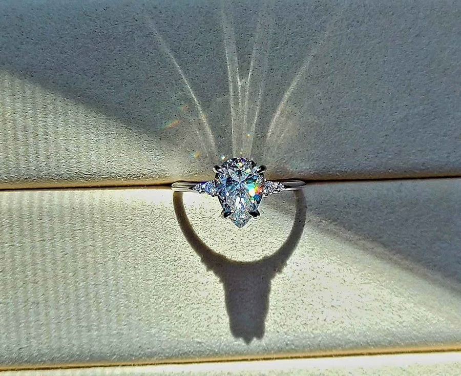 solid 14k gold 2ct 7x10mm pear moissanite ring with side moissanite